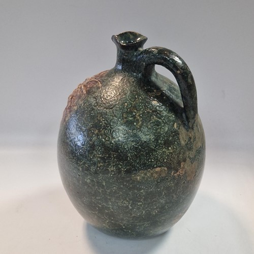 Lot 37 - Robert Wallace Martin for the Martin Brothers, a large bellied jug, circa 1896