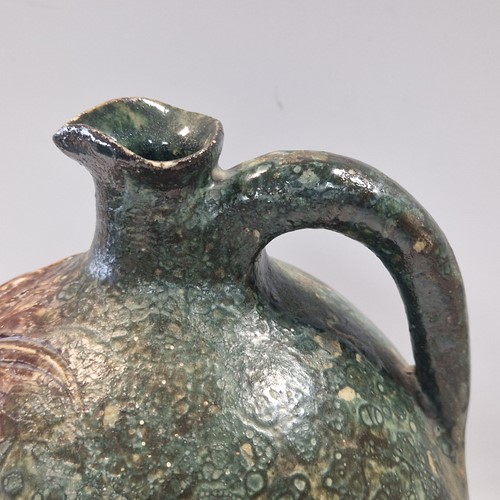 Lot 37 - Robert Wallace Martin for the Martin Brothers, a large bellied jug, circa 1896