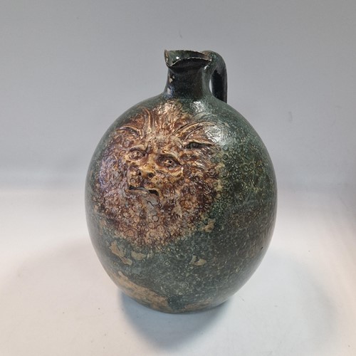 Lot 37 - Robert Wallace Martin for the Martin Brothers, a large bellied jug, circa 1896