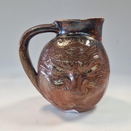 Lot 35 - Robert Wallace Martin for the Martin Brothers, a stoneware double-sided face jug