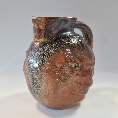 Lot 35 - Robert Wallace Martin for the Martin Brothers, a stoneware double-sided face jug