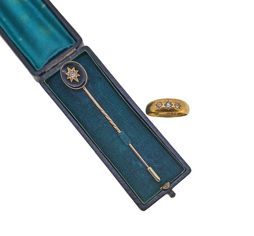 Lot 12 - An 18ct gold three stone diamond ring together with a diamond set stick pin