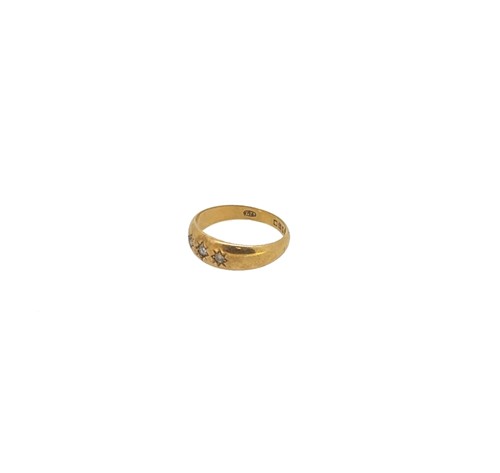 Lot 12 - An 18ct gold three stone diamond ring together with a diamond set stick pin