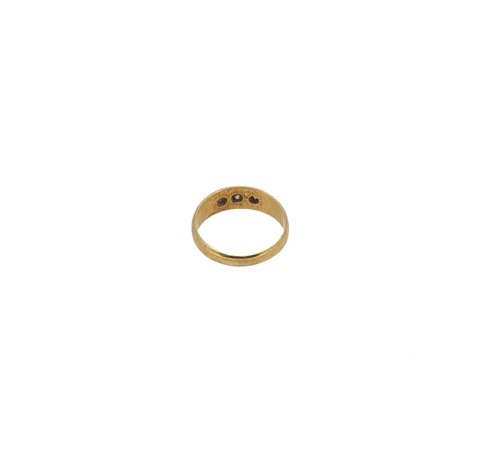 Lot 12 - An 18ct gold three stone diamond ring together with a diamond set stick pin