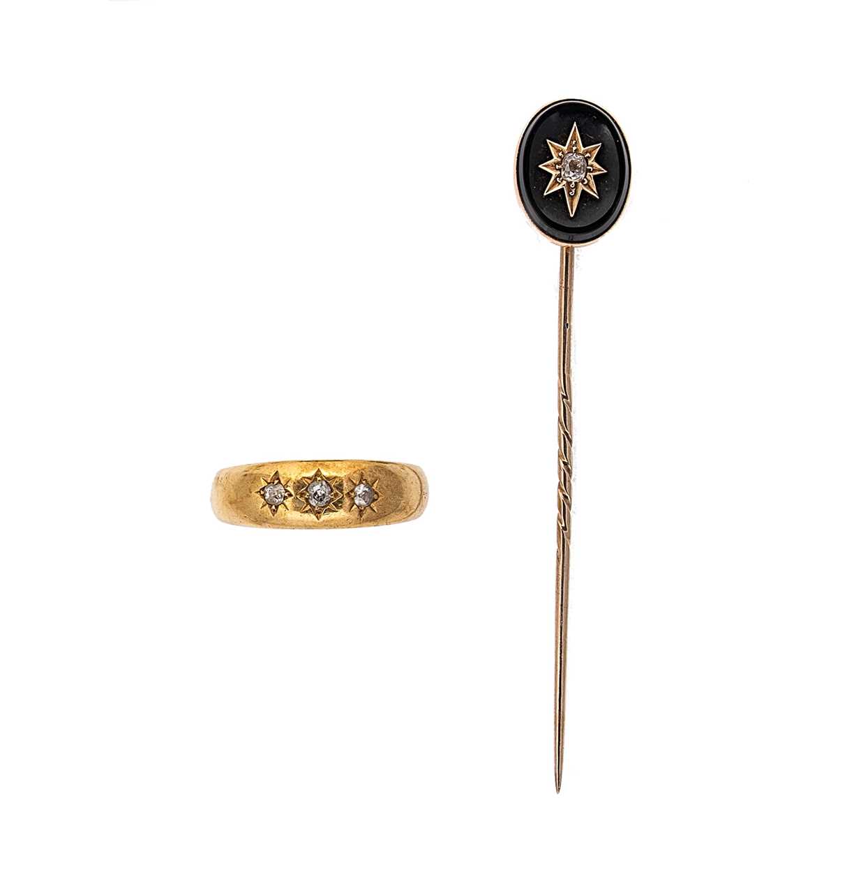 Lot 12 - An 18ct gold three stone diamond ring together with a diamond set stick pin
