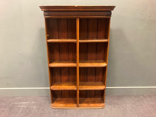 Lot 484 - An oak open bookcase with curved sides, 140.5...
