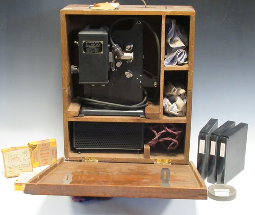Lot 85 - An old cine projector, camera and films