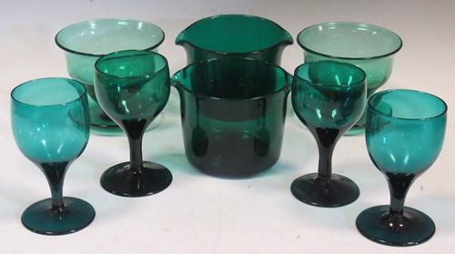 Lot 75 - A collection of green glassware, to include a...