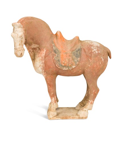 Lot 44 - A Chinese red-painted pottery figure of a standing horse, Tang Dynasty (AD 618-907)