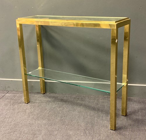 Lot 516 - A brass framed glass console table, with two...