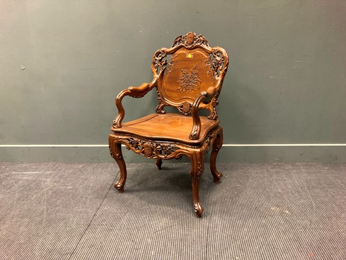 Lot 659 - A modern Asian carved hardwood armchair with...