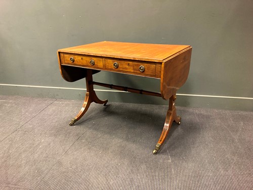 Lot 546 - A Regency mahogany and ebony strung sofa table,...