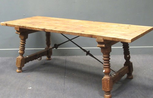 Lot 654 - A stained pine plank top refectory table, with...