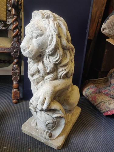 Lot 685 - A reconstituted figure of a lion and shield,...