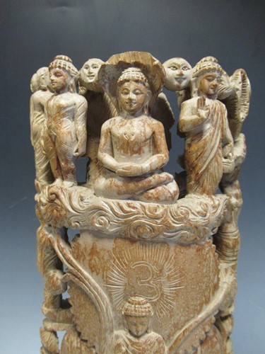 Lot 12 - Two modern Thai figures and a carved wooden...