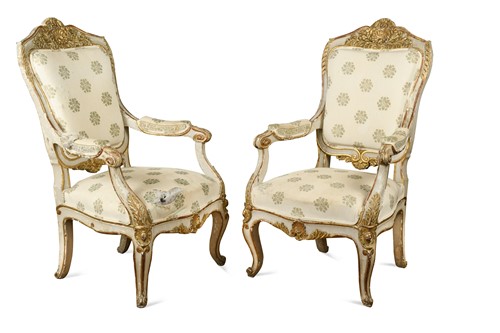 Lot 690 - A pair of rococo style white painted and parcel gilt armchairs, late 19th century