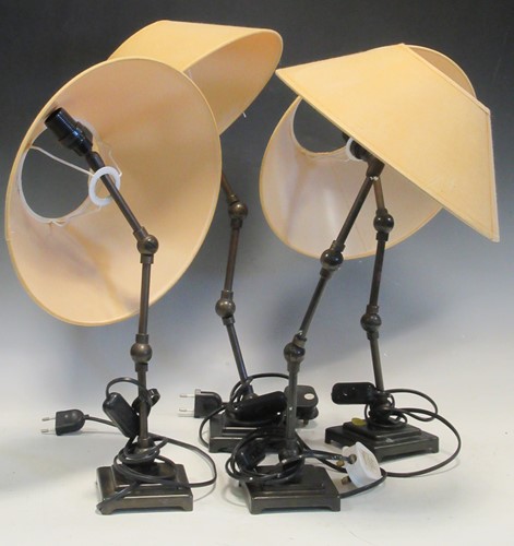 Lot 122 - Set of four articulated table lamps