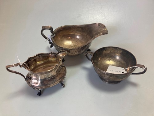 Lot 248A - A silver sauce boat, together with a silver...