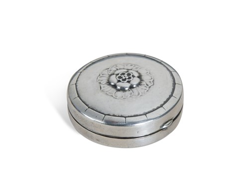 Lot 102 - Georg Jensen (1866-1935), a Danish silver pill box, pattern no. 79