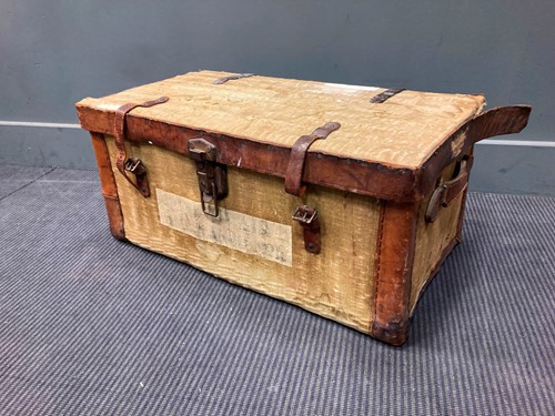 Lot 81 - A canvas and leather trunk, 32 x 72 x 41cm