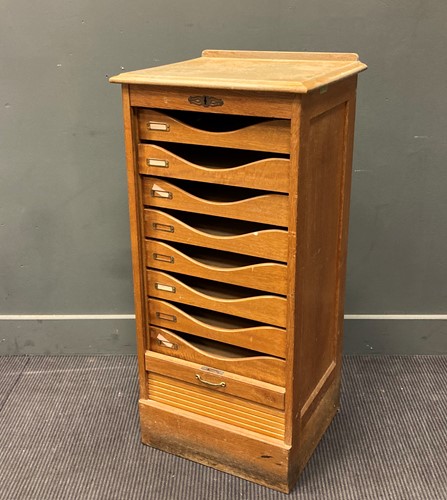 Lot 613 - A 20th century pale oak tambour-fronted filing...