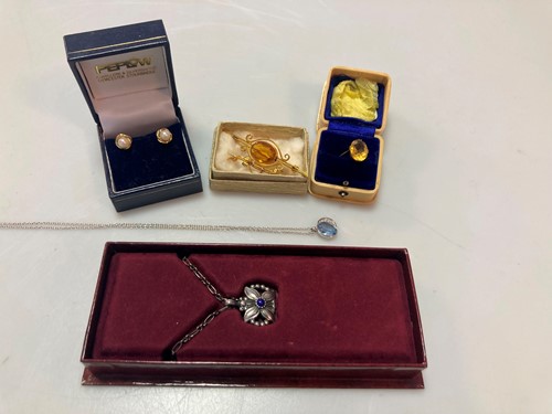 Lot 216 - A citrine ring stamped '9CT, a citrine brooch...