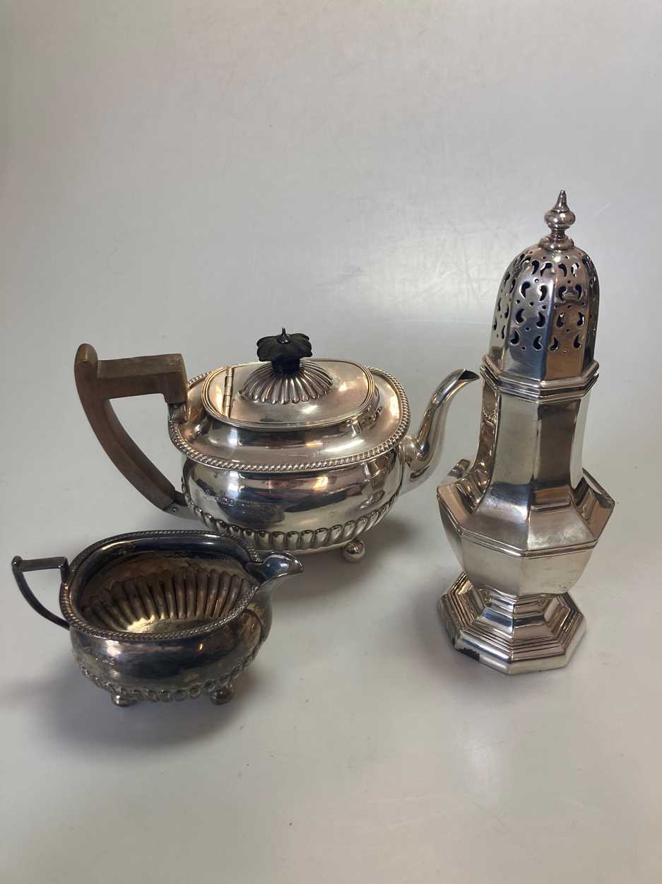 Lot 248 - A silver teapot and milk jug, together with a...