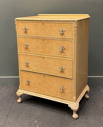 Lot 585 - A modern maple four drawer chest raised on...
