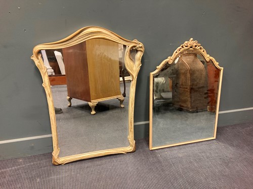Lot 586 - A modern lily leaf design wall mirror 89 x...