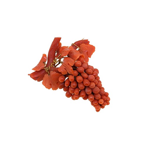 Lot 48 - A carved coral brooch