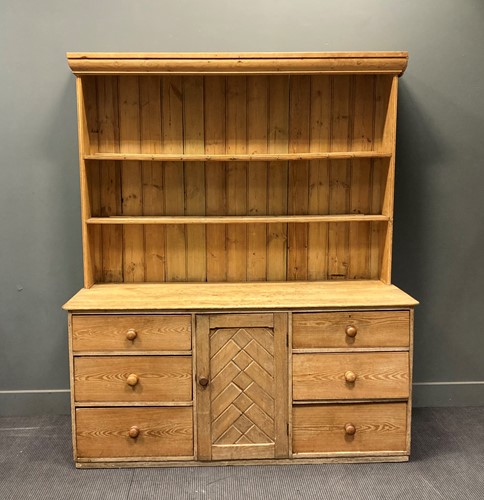Lot 525 - A late 19th century pine shelf back dresser,...