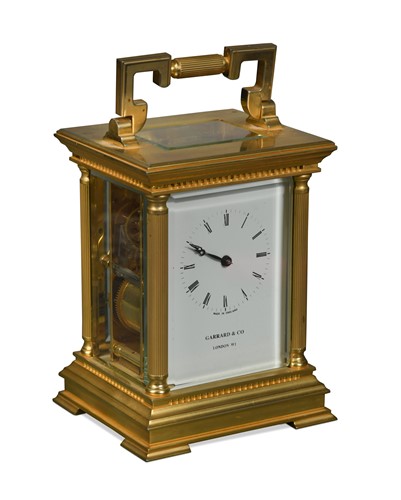 Lot 767 - A modern gilt brass carriage clock marked Garrard & Co