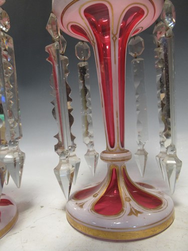 Lot 74 - A pair of ruby flash lustres 28.5cm high and a...