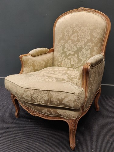 Lot 502 - A Louis XV style carved beechwood bergère...