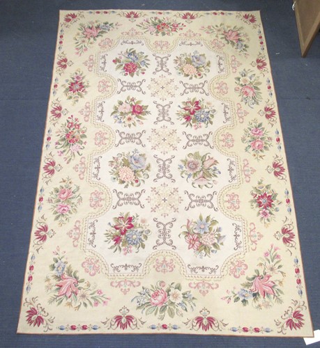 Lot 700 - A needlework carpet decorated with floral...