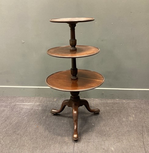 Lot 565 - A 19th century mahogany there tier dumb waiter,...