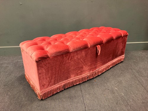 Lot 573 - A serpentine-fronted ottoman with pink velvet...