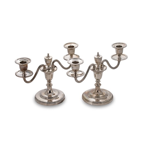 Lot 455 - A visual pair of Elizabeth II silver two light metamorphic candelabra