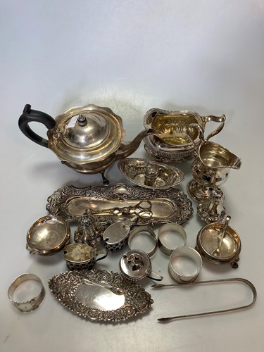 Lot 226 - A collection of silverware including a teapot,...