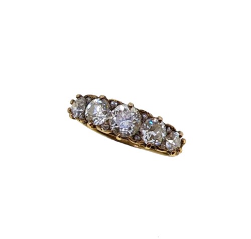 Lot 141 - A diamond set carved half hoop ring