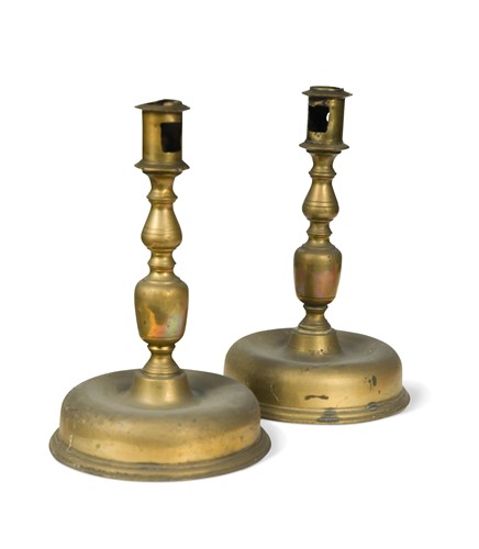 Lot 583 - A pair of Spanish brass candlesticks, probably 17th century