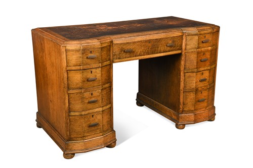 Lot 235 - Attributed to Heal's, an Art Deco oak kneehole desk