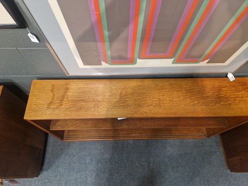 Lot 184 - A Cotswold School oak low bookcase