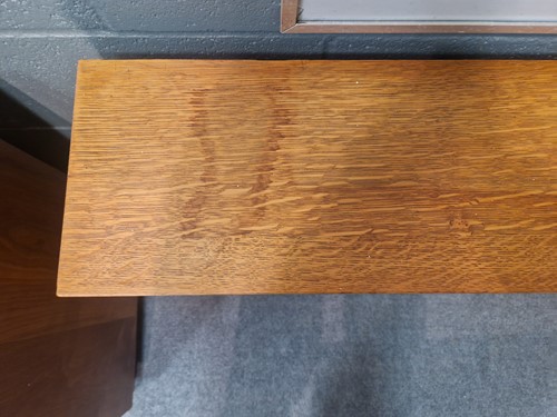 Lot 184 - A Cotswold School oak low bookcase