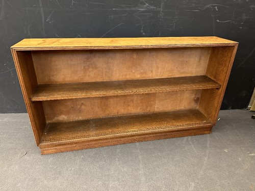 Lot 184 - A Cotswold School oak low bookcase