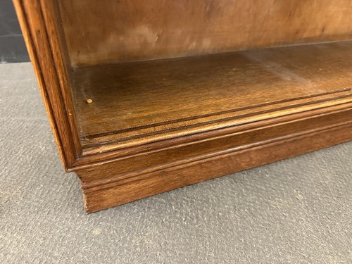 Lot 184 - A Cotswold School oak low bookcase