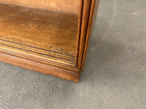 Lot 184 - A Cotswold School oak low bookcase