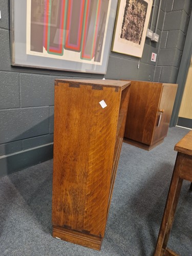 Lot 184 - A Cotswold School oak low bookcase
