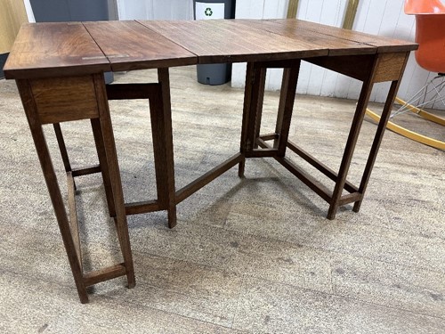 Lot 191 - Attributed to Frederick (Fred) Francis Foster (1885-1968), a metamorphic walnut occasional table