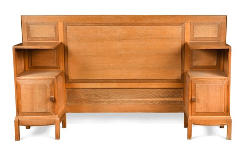 Lot 216 - Paul Matt for Brynmawr Furniture, a golden oak single bed head, circa 1930